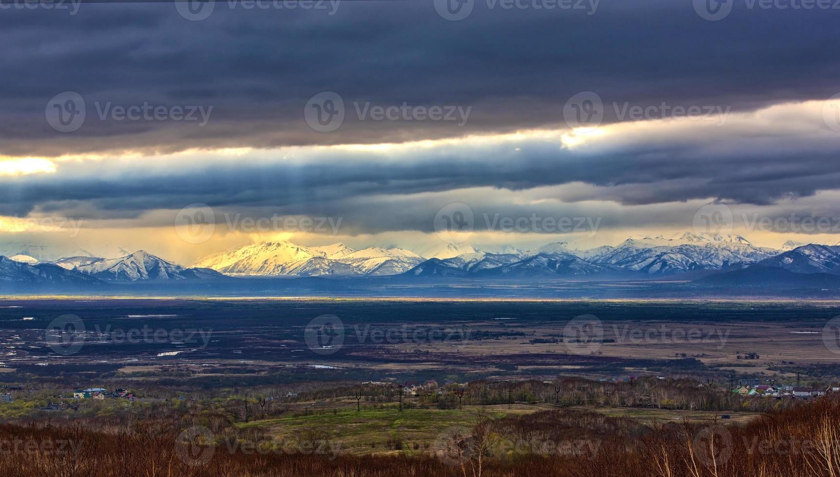 snowy mountains and storm clouds autumn on Kamchatka photo