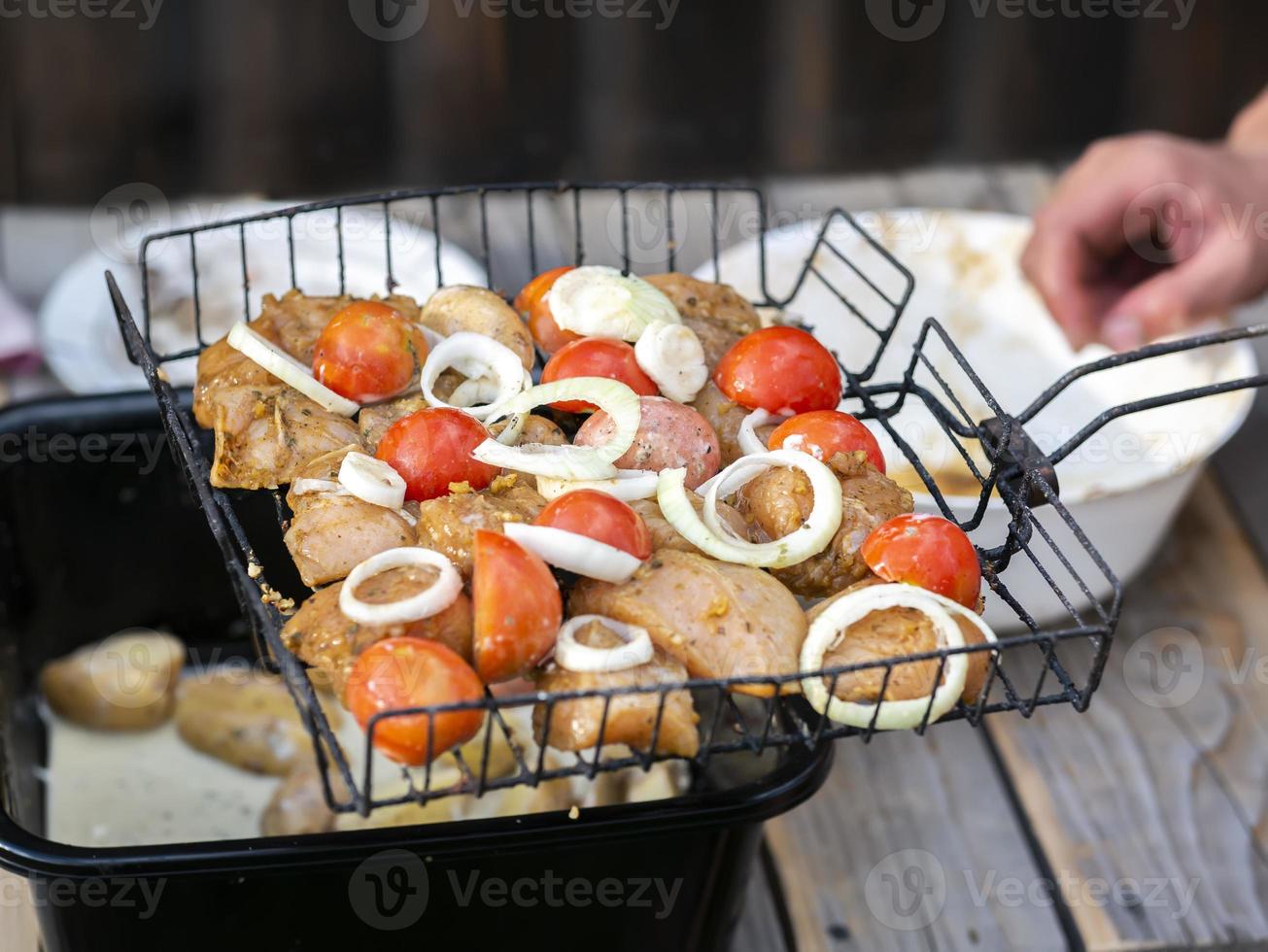 juicy grilled meat on the grill, barbecue in the yard photo