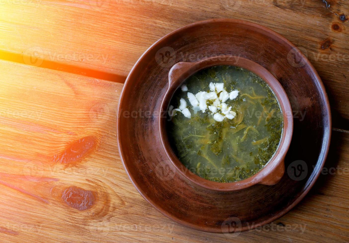 Diet sorrel soup with egg. on a wooden table. photo