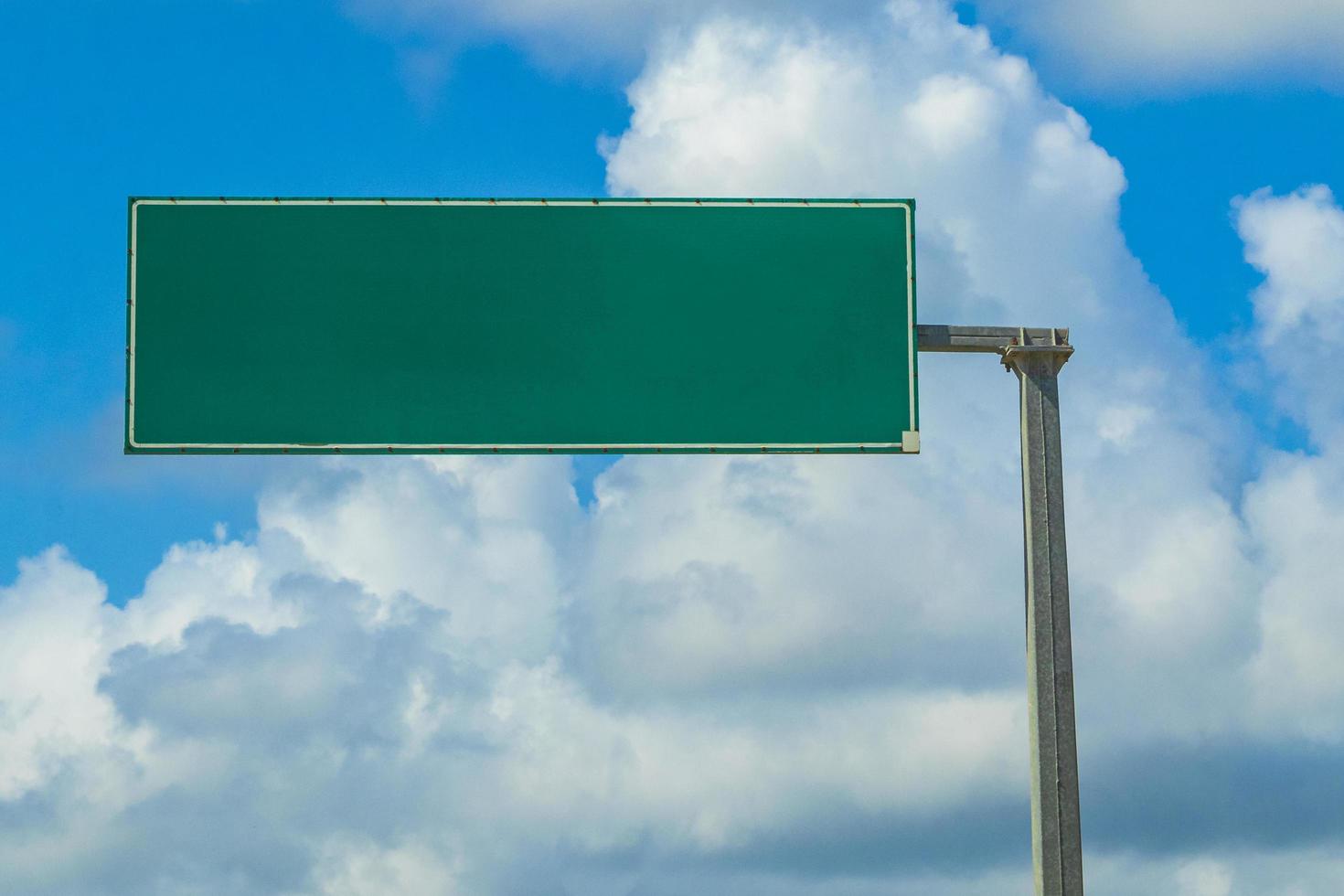 Directional green blank empty road sign in Tulum Mexico. photo