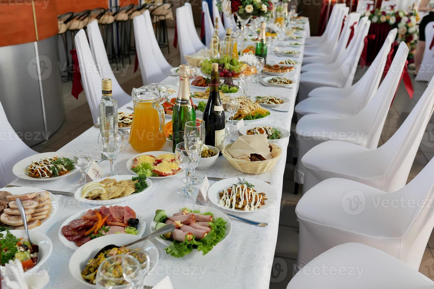 served table with food and drinks in the restaurant photo