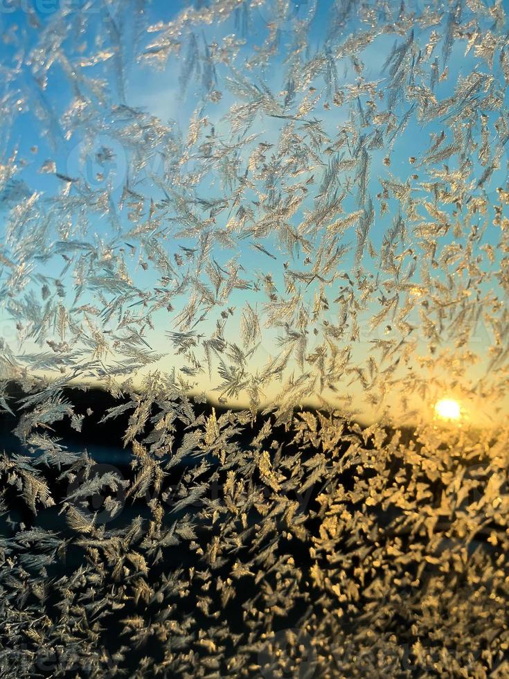 Frozen side window of car closeup photo