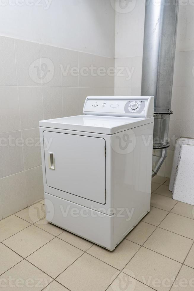 industrial washing machine in the laundry room photo