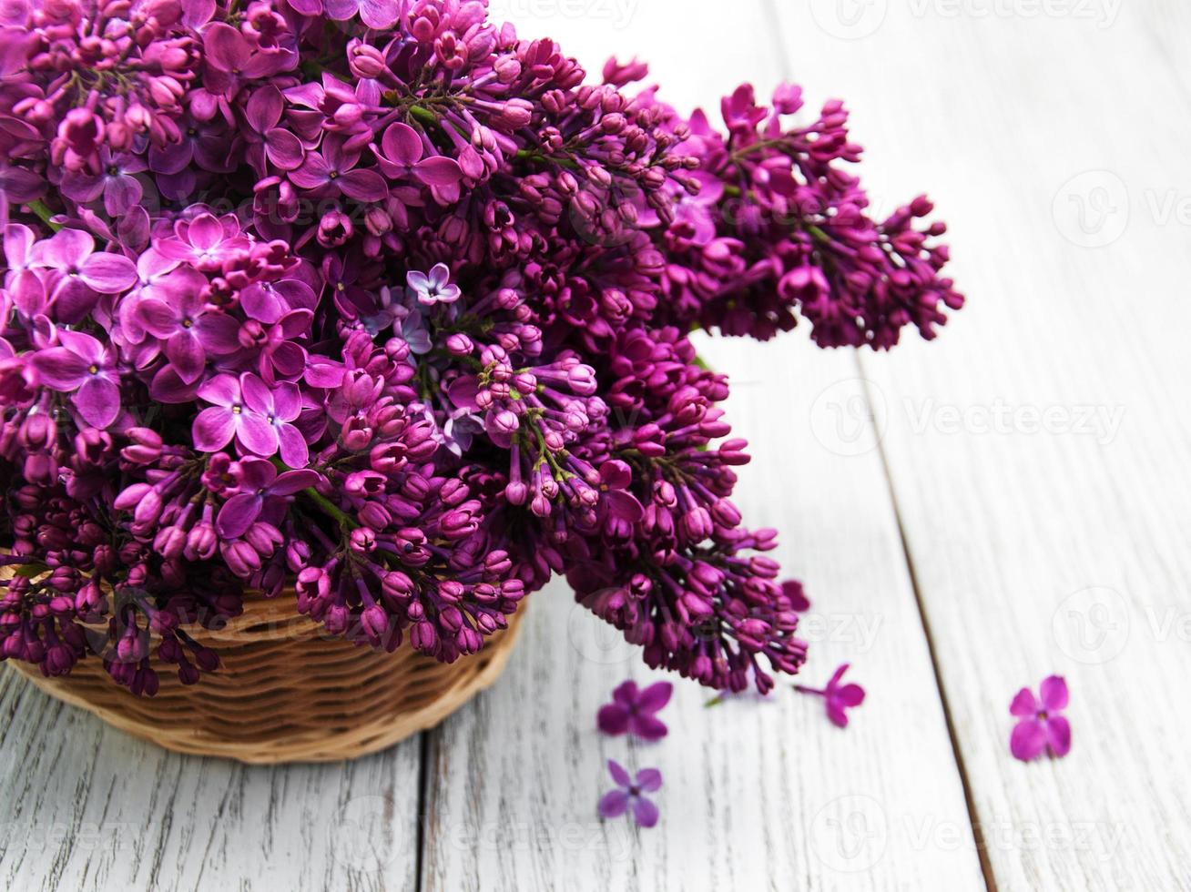 Lilac flowers on table photo