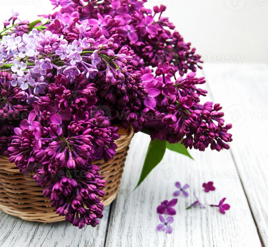 Lilac flowers on table photo