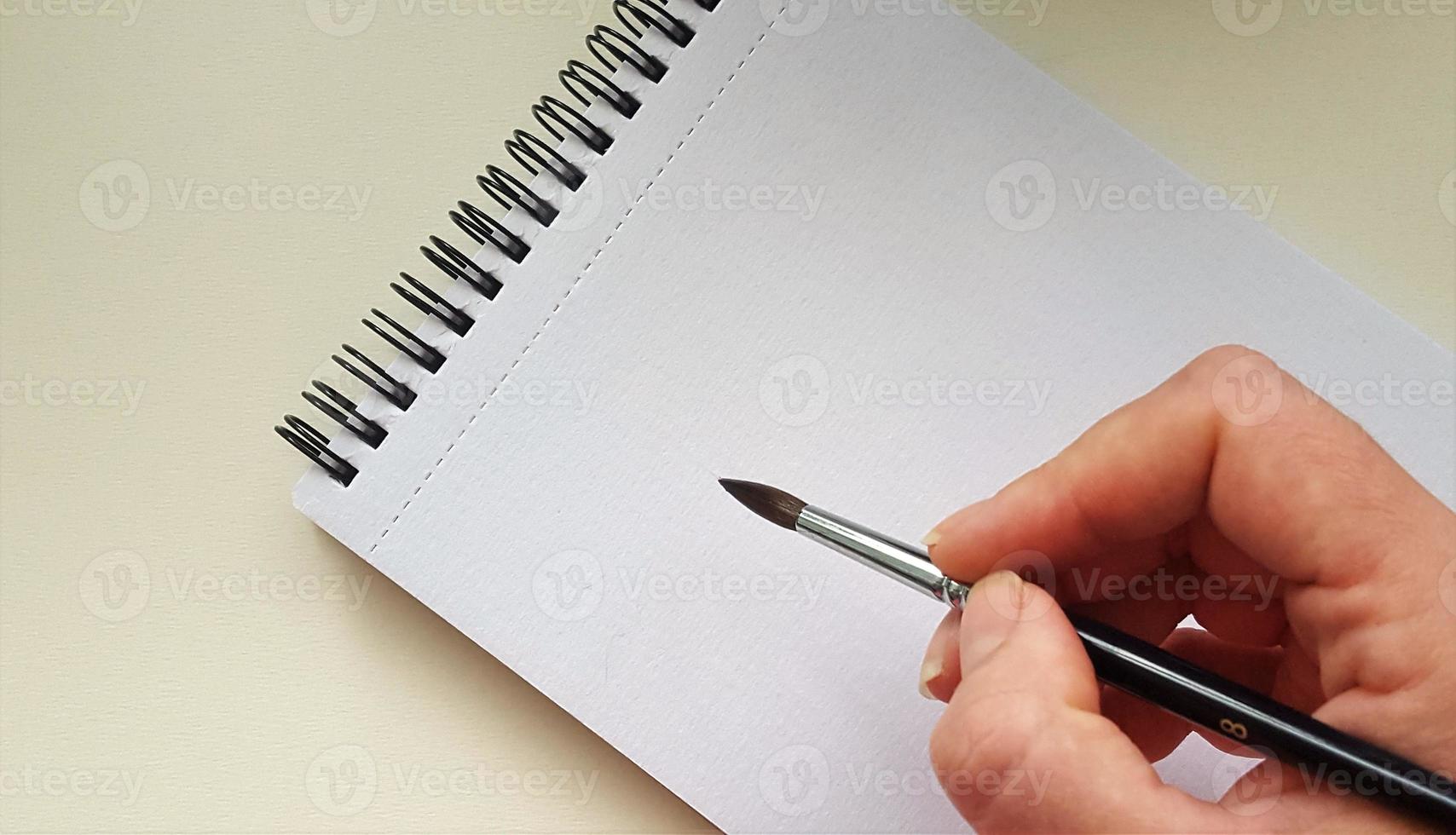 Notebook with spiral for watercolor. Mock up for artwork. photo