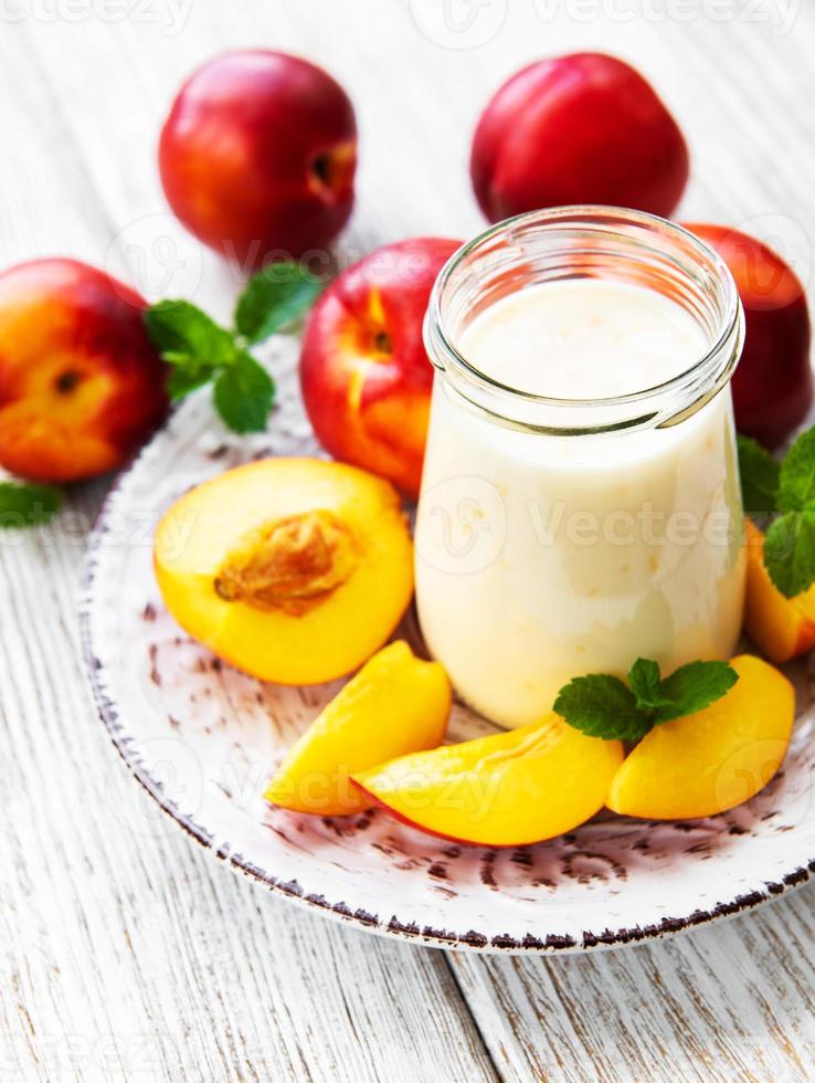 Natural yogurt with peach photo