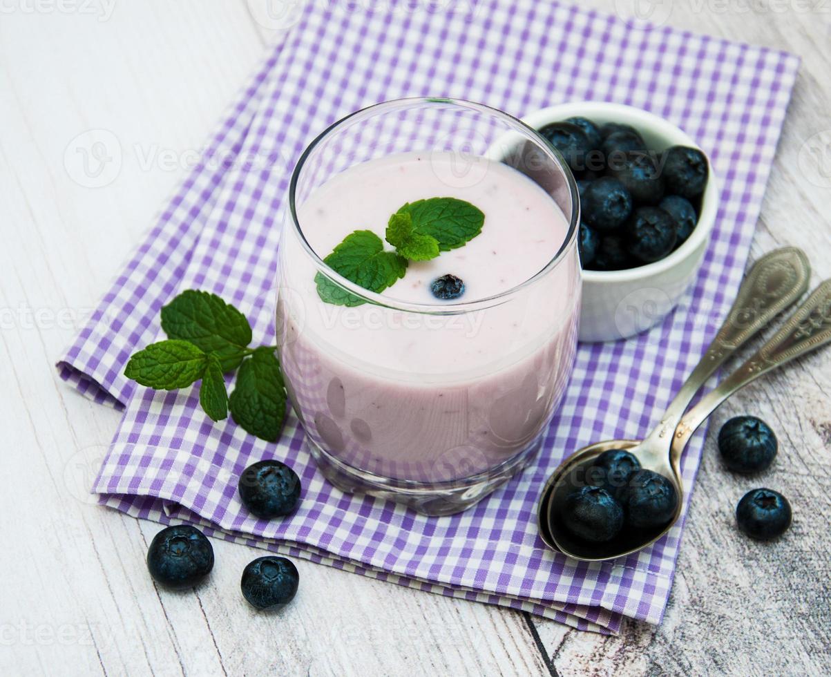 Glass with blueberry yogurt photo