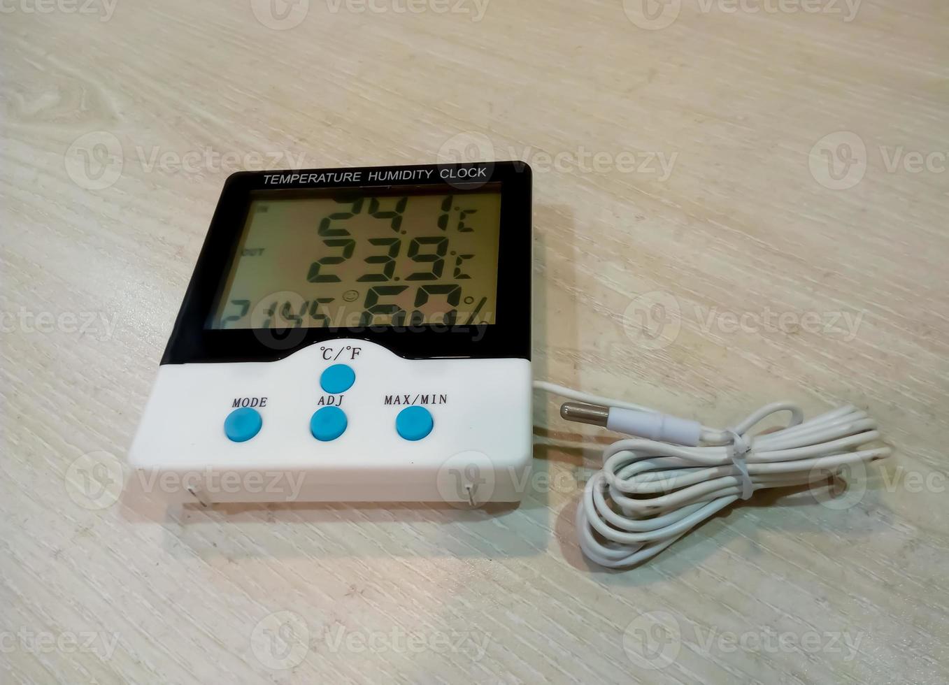 Digital temperature and humidity clock isolated photo