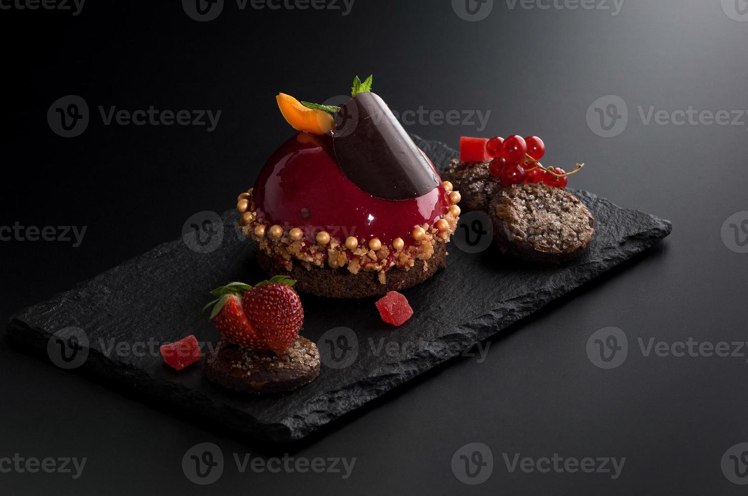 cake with berries on a dark background photo