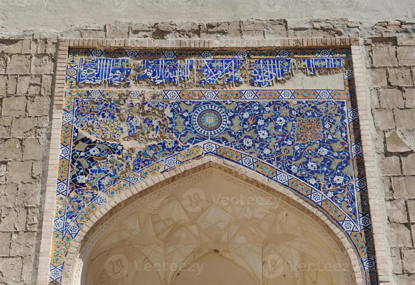 Elements of ancient architecture of Central Asia. Ceiling in the form of a dome in a traditional ancient Asian mosaic photo