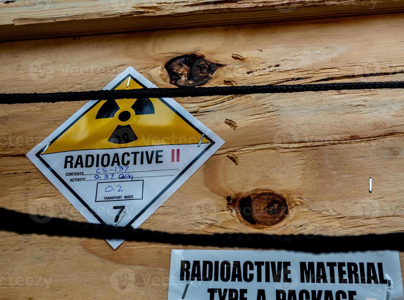 Radiation label beside the transport wooden box Type A package photo