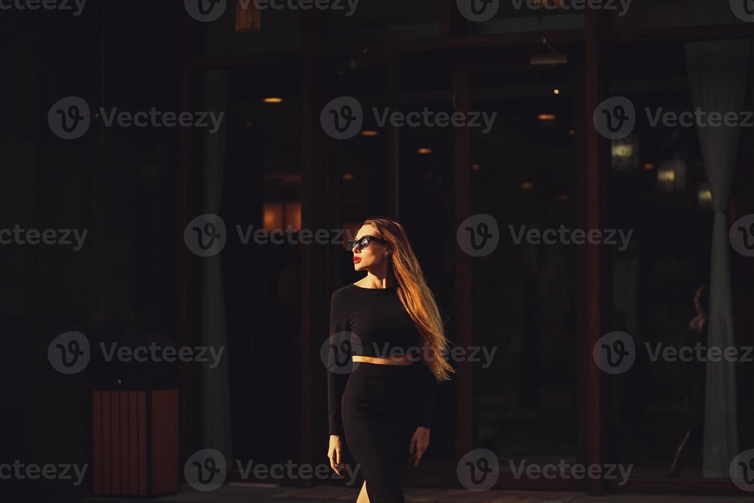 Beautiful  young woman wearing sunglasses photo