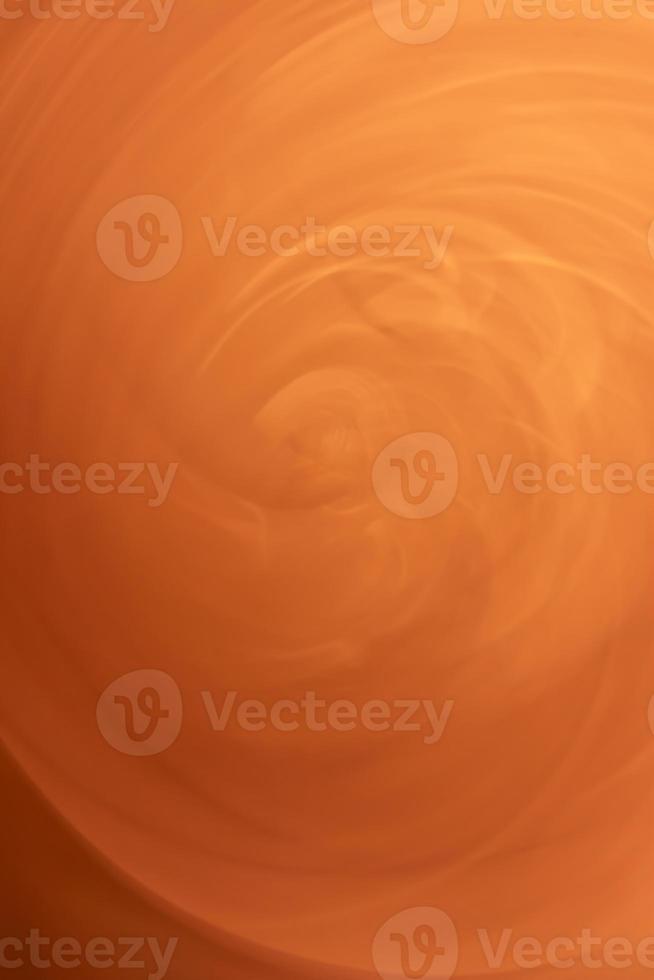 Orange sand swirl. Vertical abstract. Backdrop photo