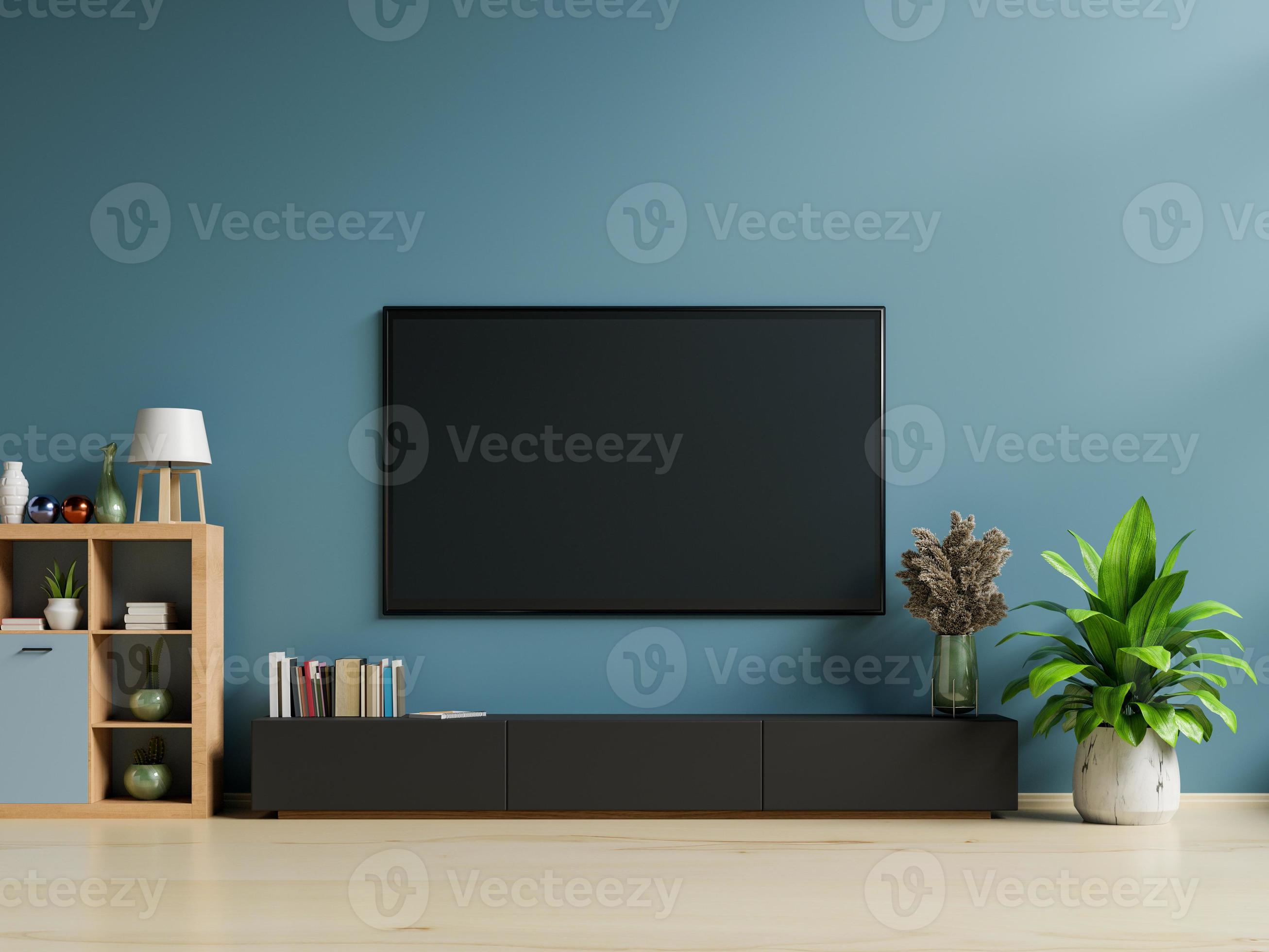 Smart TV on the dark blue wall in living room,minimal design. 5751455 Stock  Photo at Vecteezy