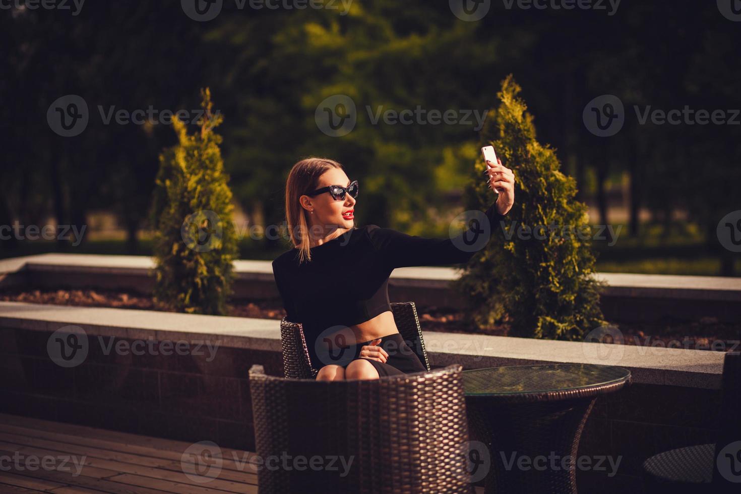Elegant business woman in black dress. photo