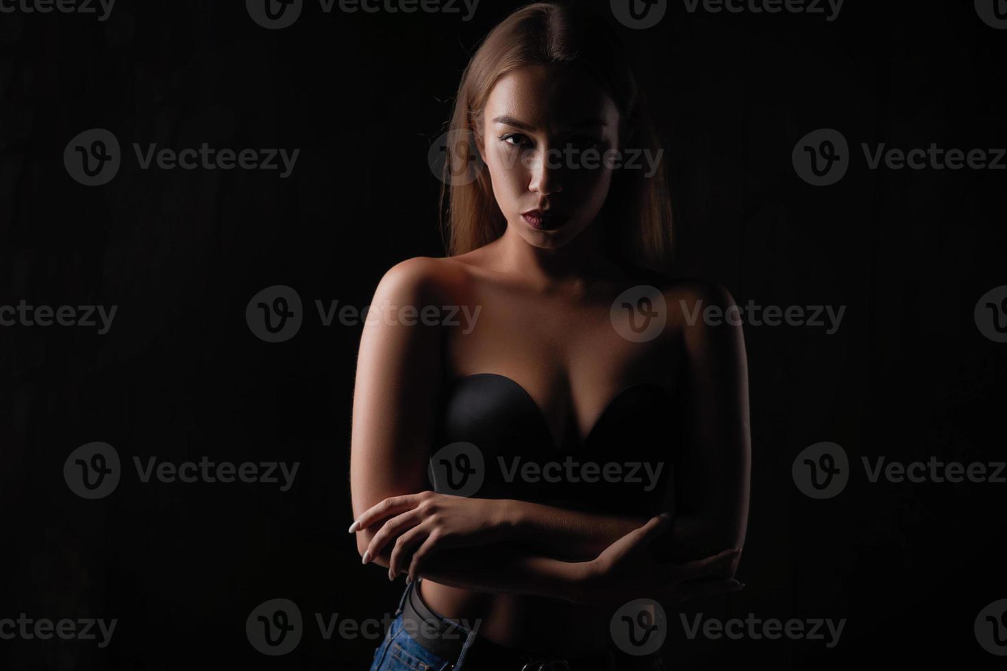 portrait of a beautiful girl on a dark background photo