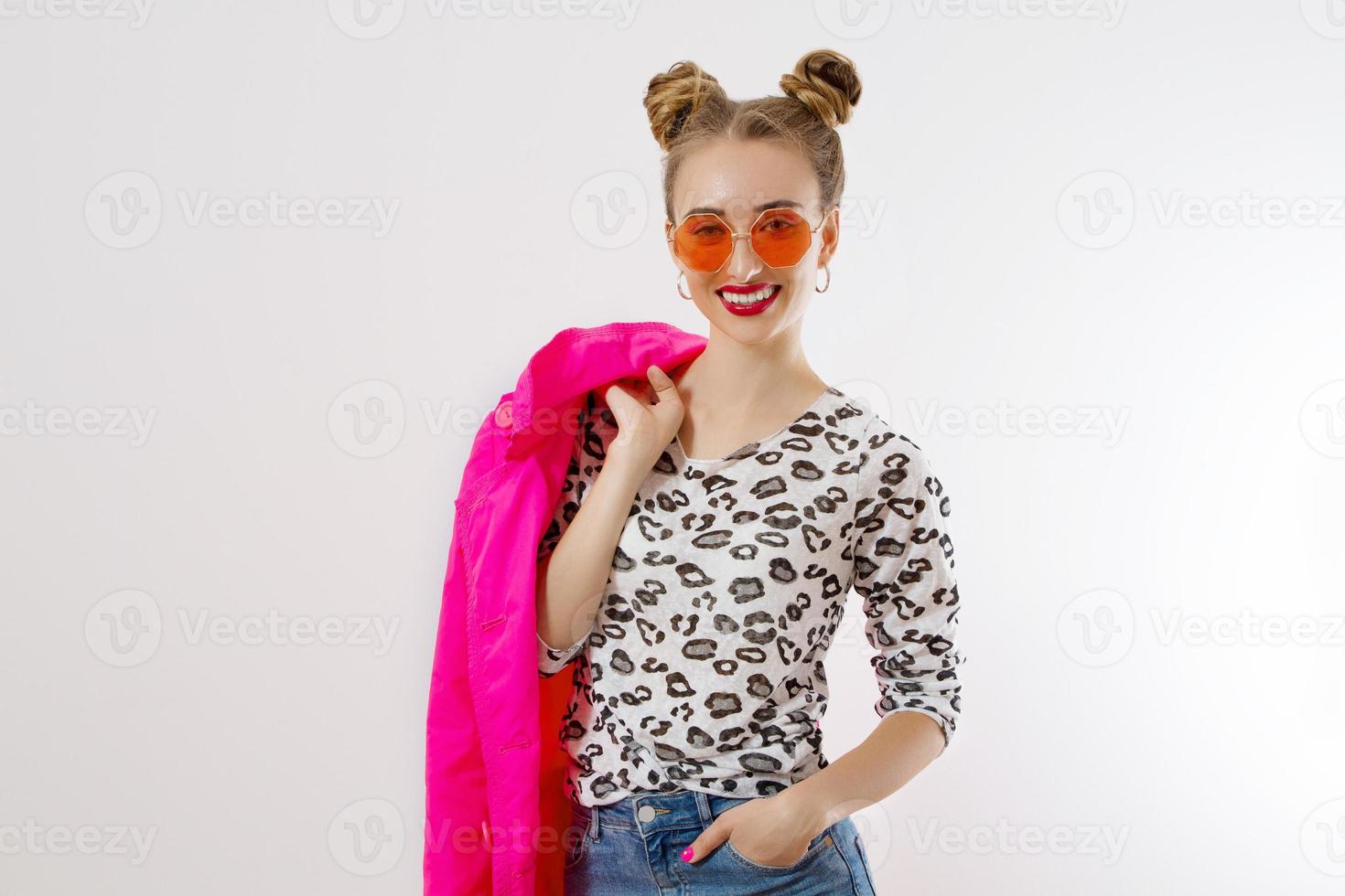 Happy, shock, excited woman face closeup. Girl in bright pink autumn clothes, red sunglasses isolated on white background, copy space. Beautiful female surprised, cheerful. Fun funny model screaming photo