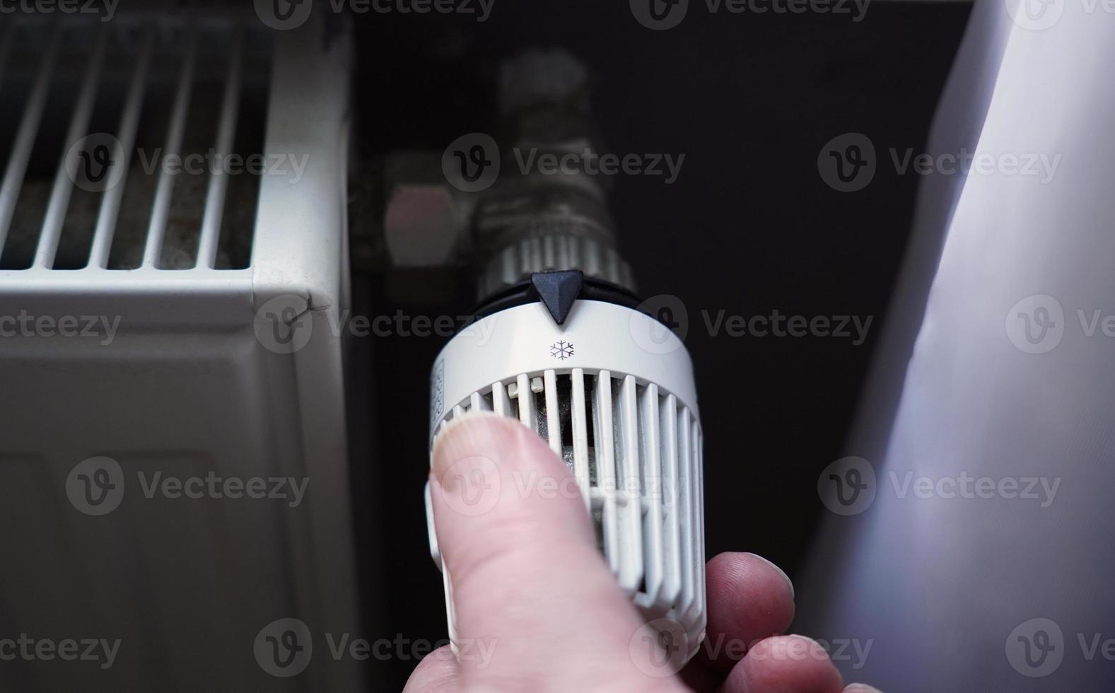 turning off thermostat on radiator to save energy due to increasing heating costs 5754311 Stock