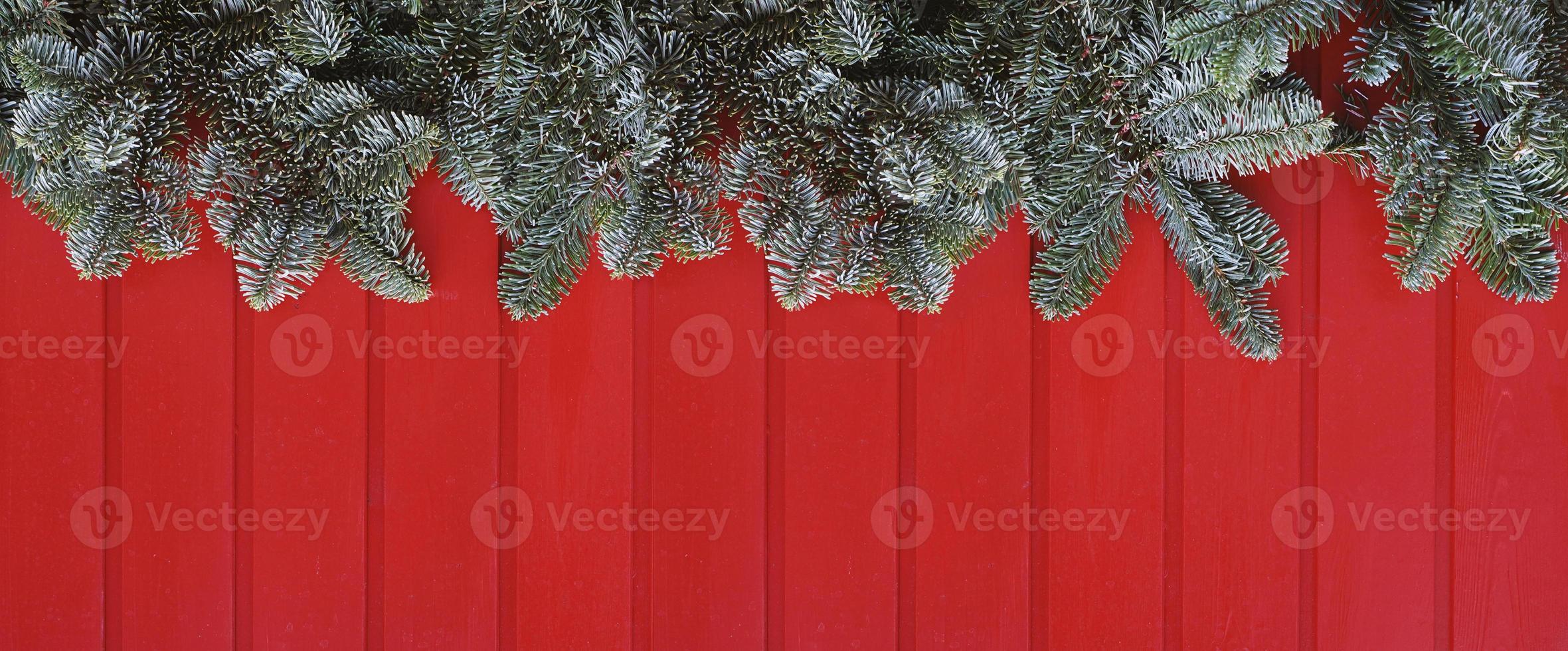 christmas decoration web banner or header image with red wood and green fir branches photo