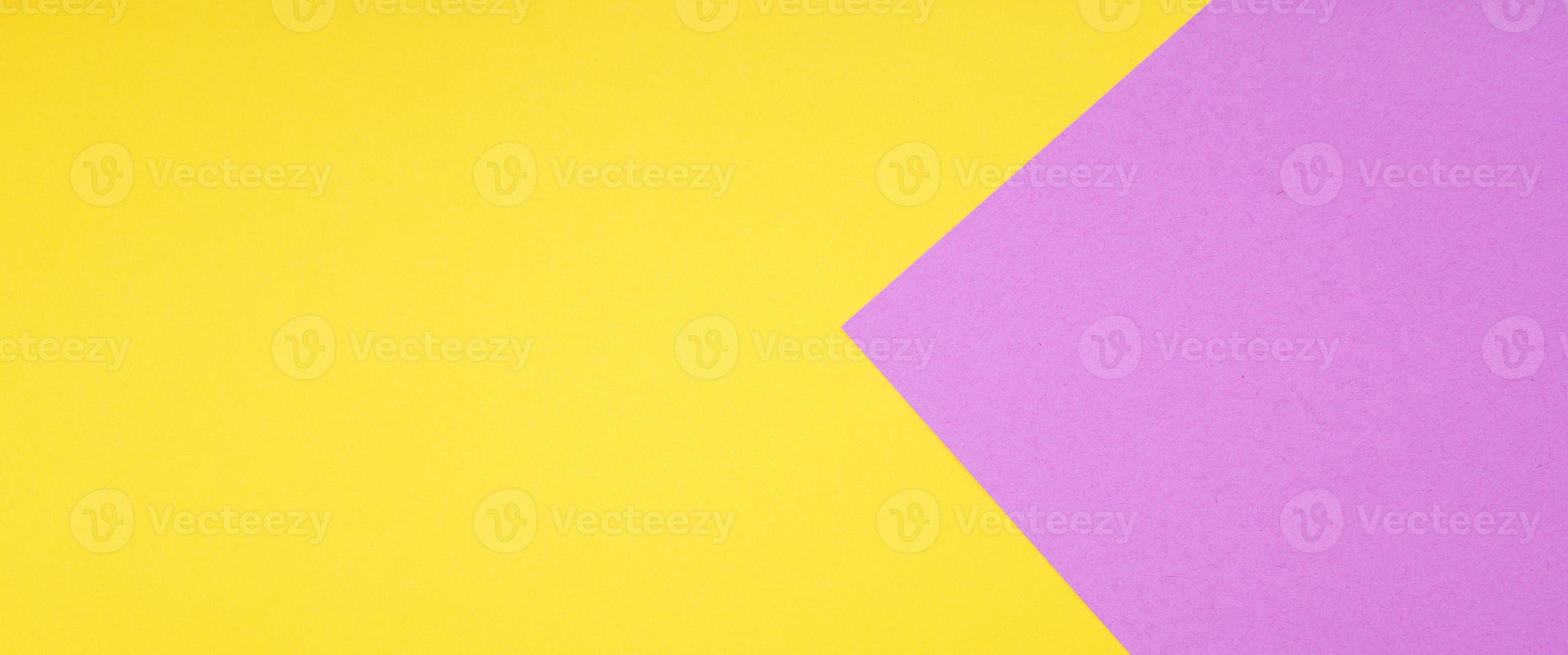 yellow and pink two color paper background in web banner format photo