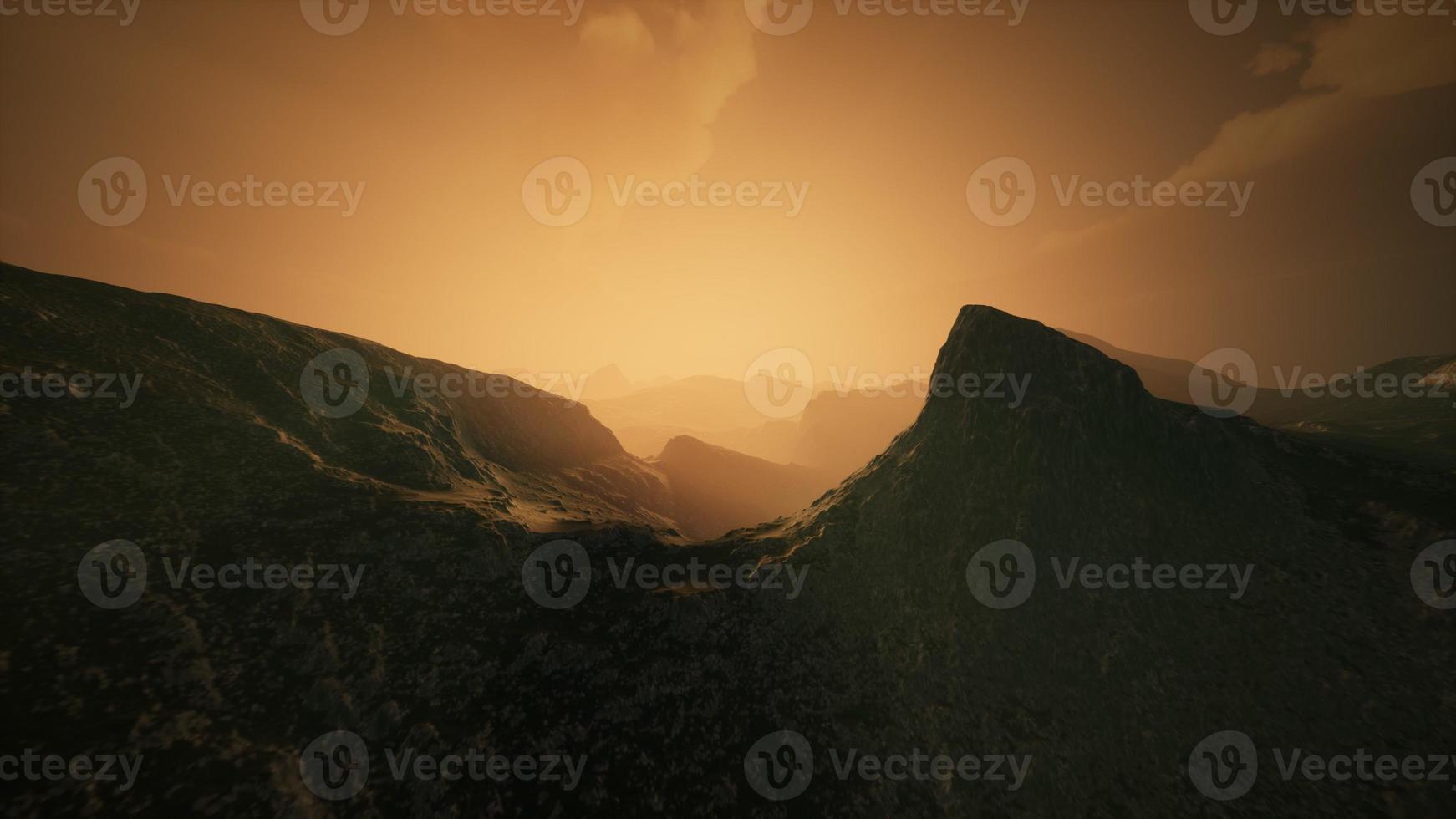 High mountain peaks covered with dramatic heavy fog photo