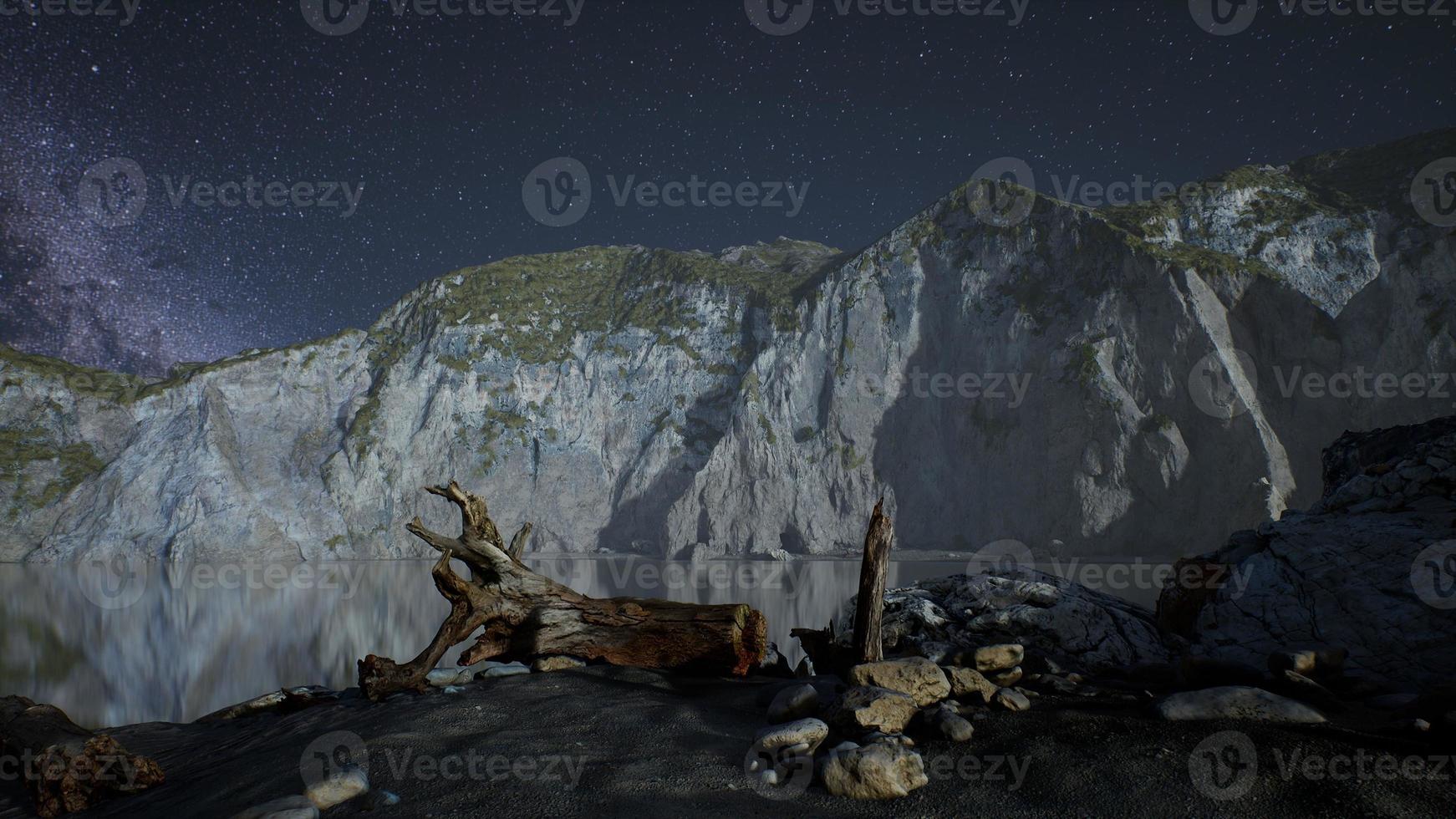 hyperlapse of night starry sky with mountain and ocean beach in Lofoten Norway photo