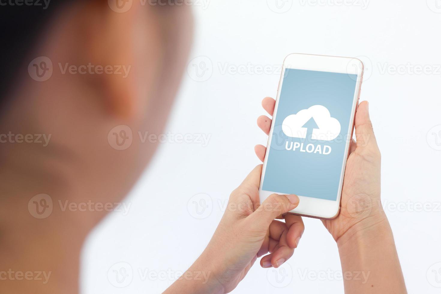 Smartphone on hand opening cloud uploading concept on phone screen. woman or man hand upload from mobile phone to store data on server photo