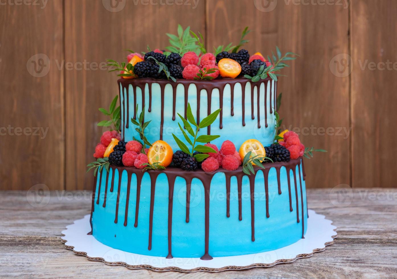 wedding cake in two tiers with fresh berries photo