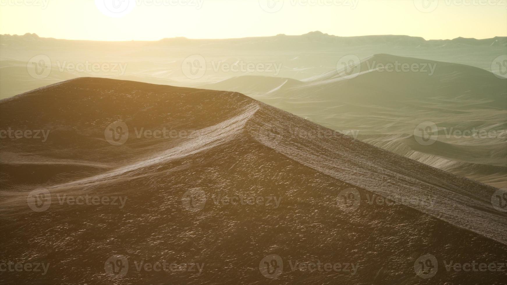 Aerial view on big sand dunes in Sahara desert at sunrise photo
