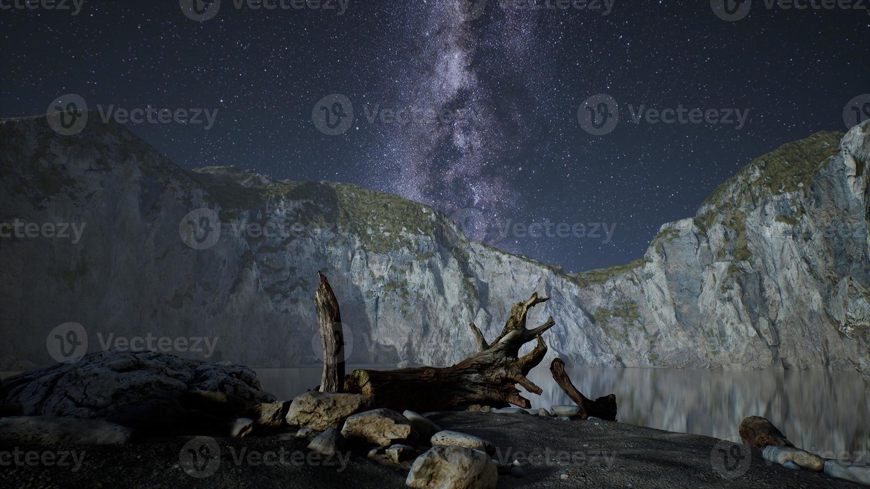 hyperlapse of night starry sky with mountain and ocean beach in Lofoten Norway photo