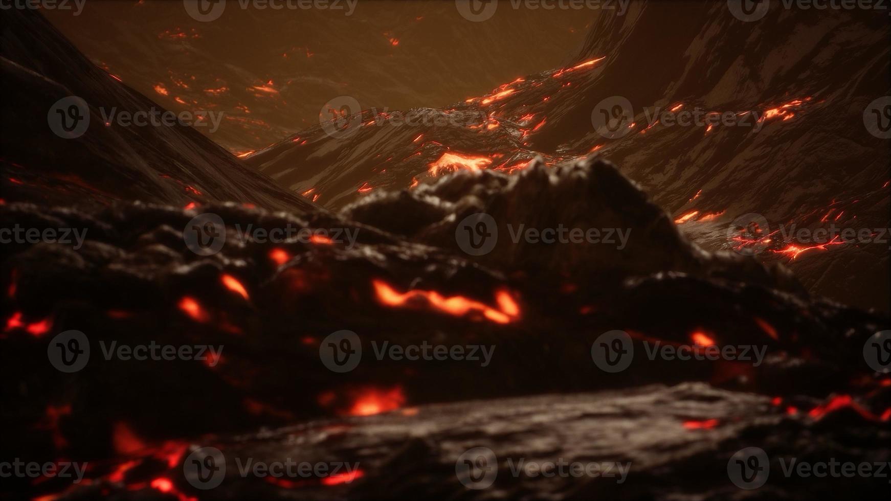 Red Orange vibrant Molten Lava flowing onto grey lavafield and glossy rocky land photo