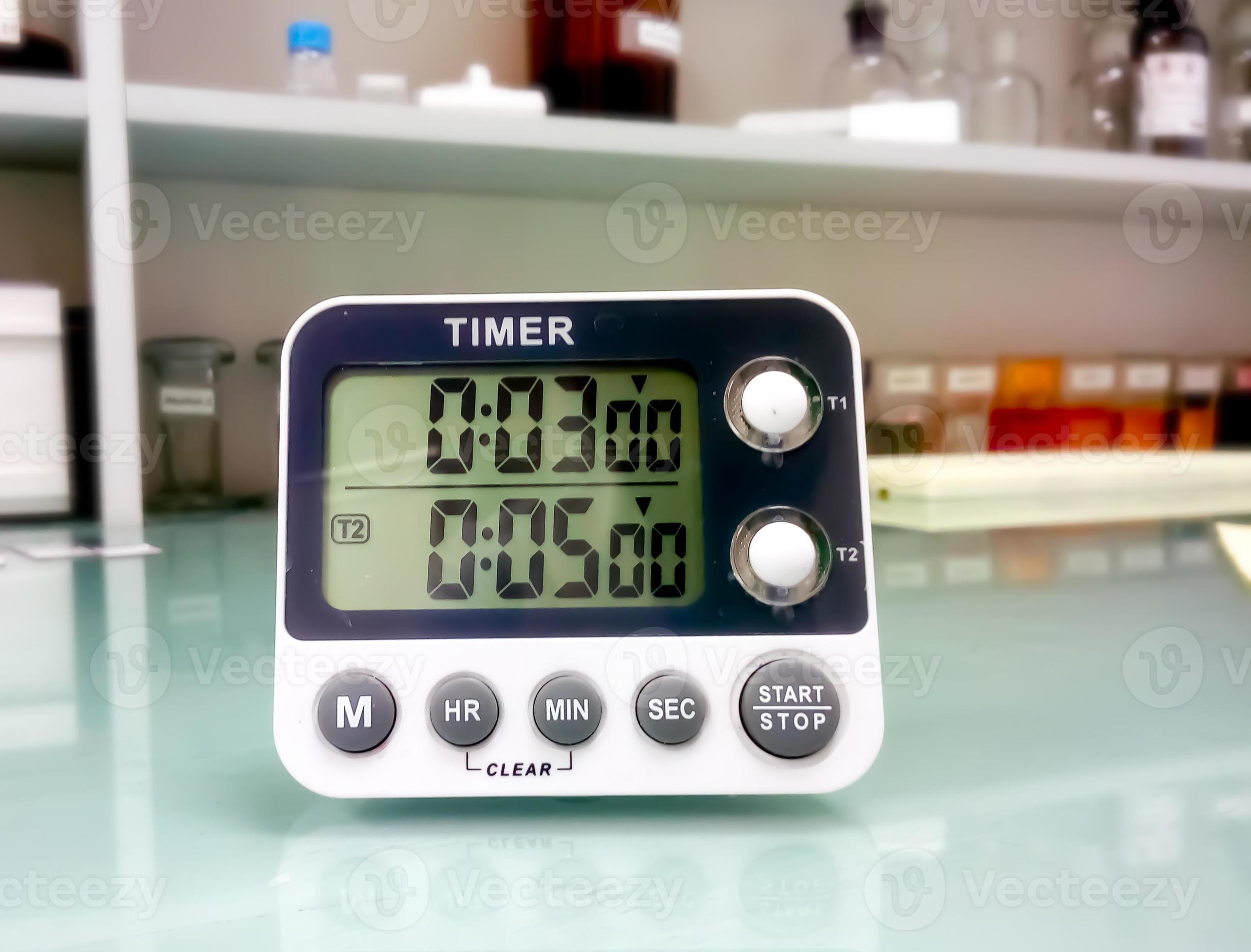 Closeup stop watch in laboratory. Timer. Laboratory test time counting