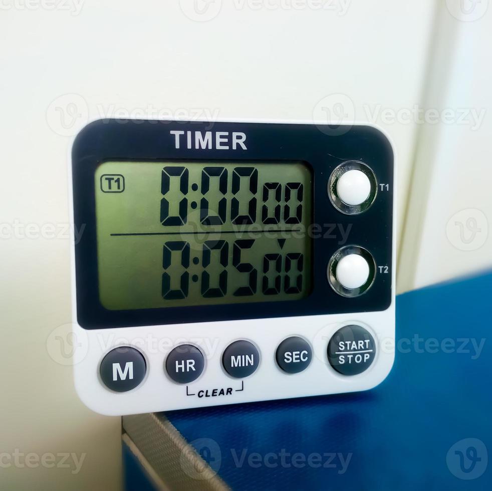 Closeup stop watch in laboratory. Timer. Laboratory test time counting concept.Stopwatch. photo