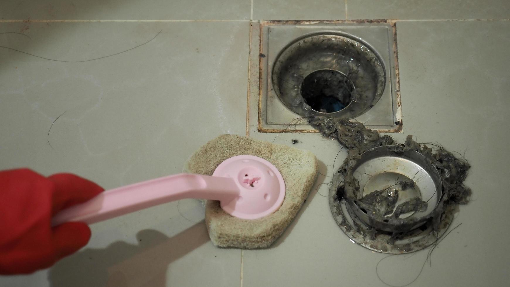 Drain cleaning. Clogged and dirty sewer pipes floor drain. photo