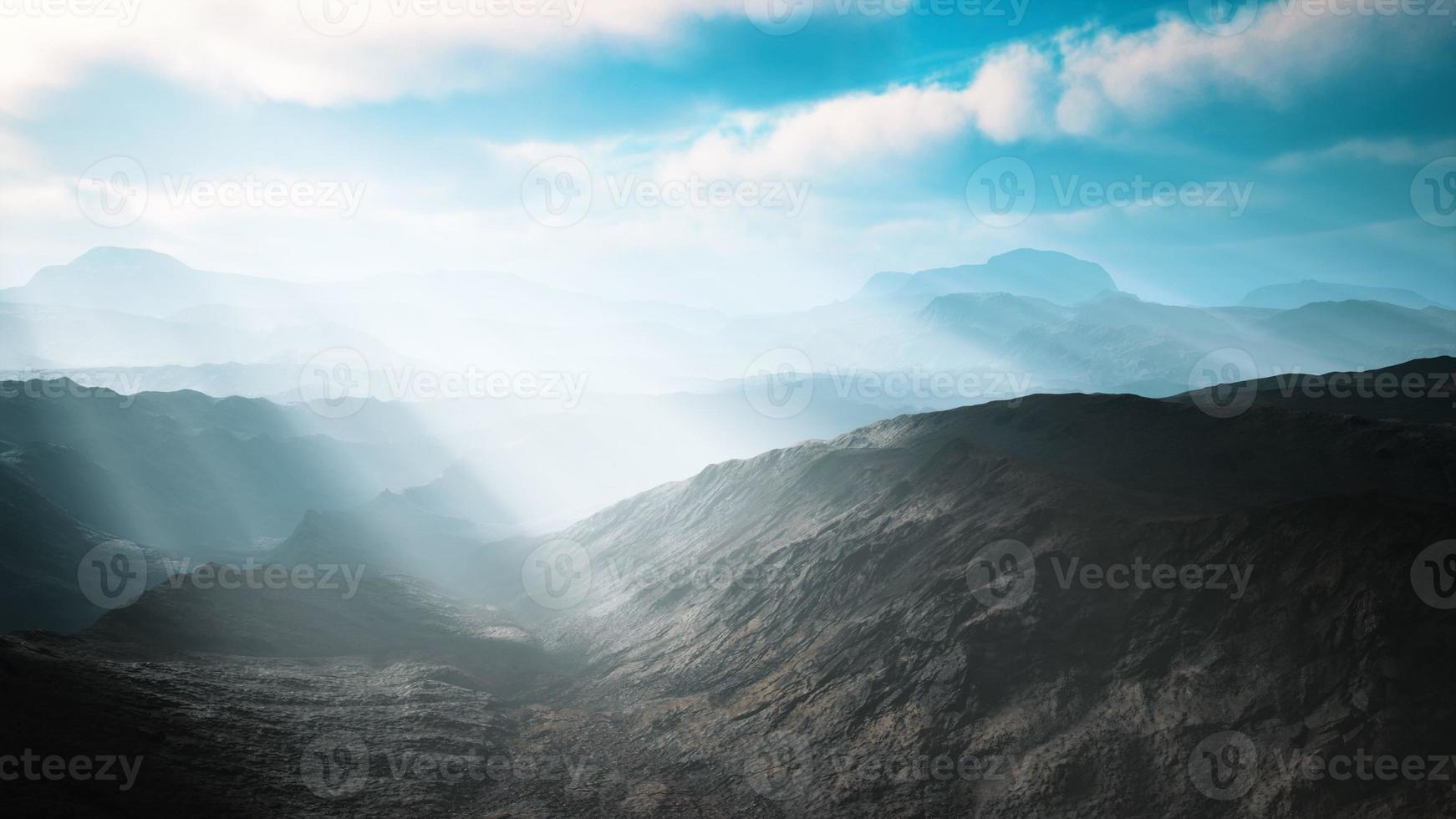 aerial vulcanic desert landscape with rays of light photo