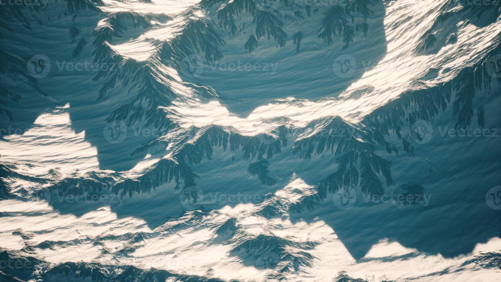 Aerial view of the Alps mountains in snow photo