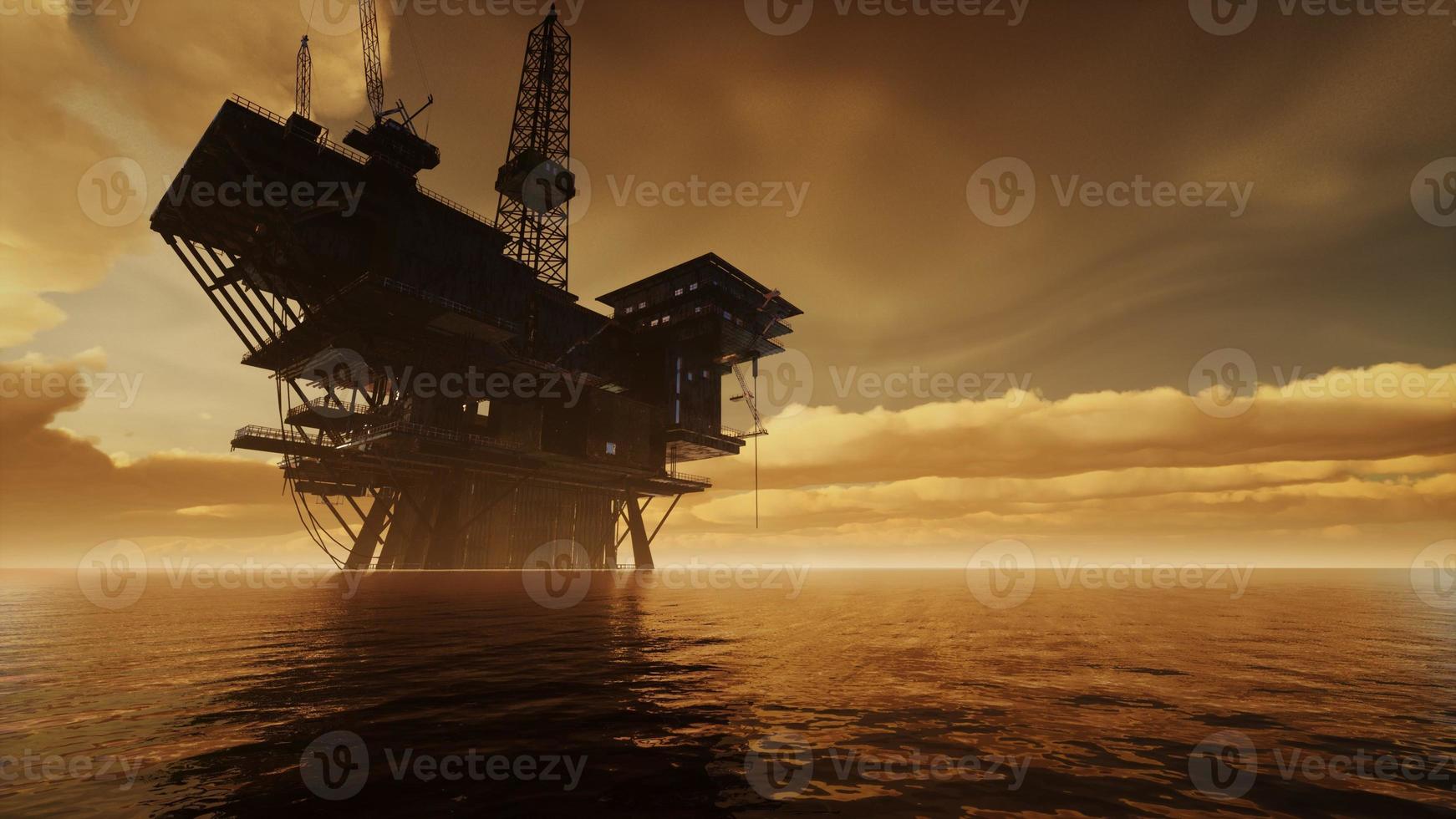 Offshore Jack Up Rig in The Middle of The Sea at Sunset Time photo