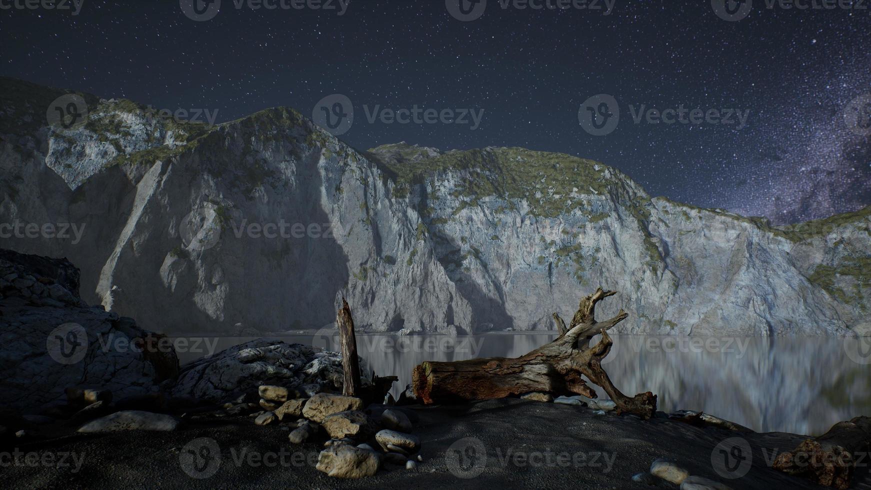 hyperlapse of night starry sky with mountain and ocean beach in Lofoten Norway photo