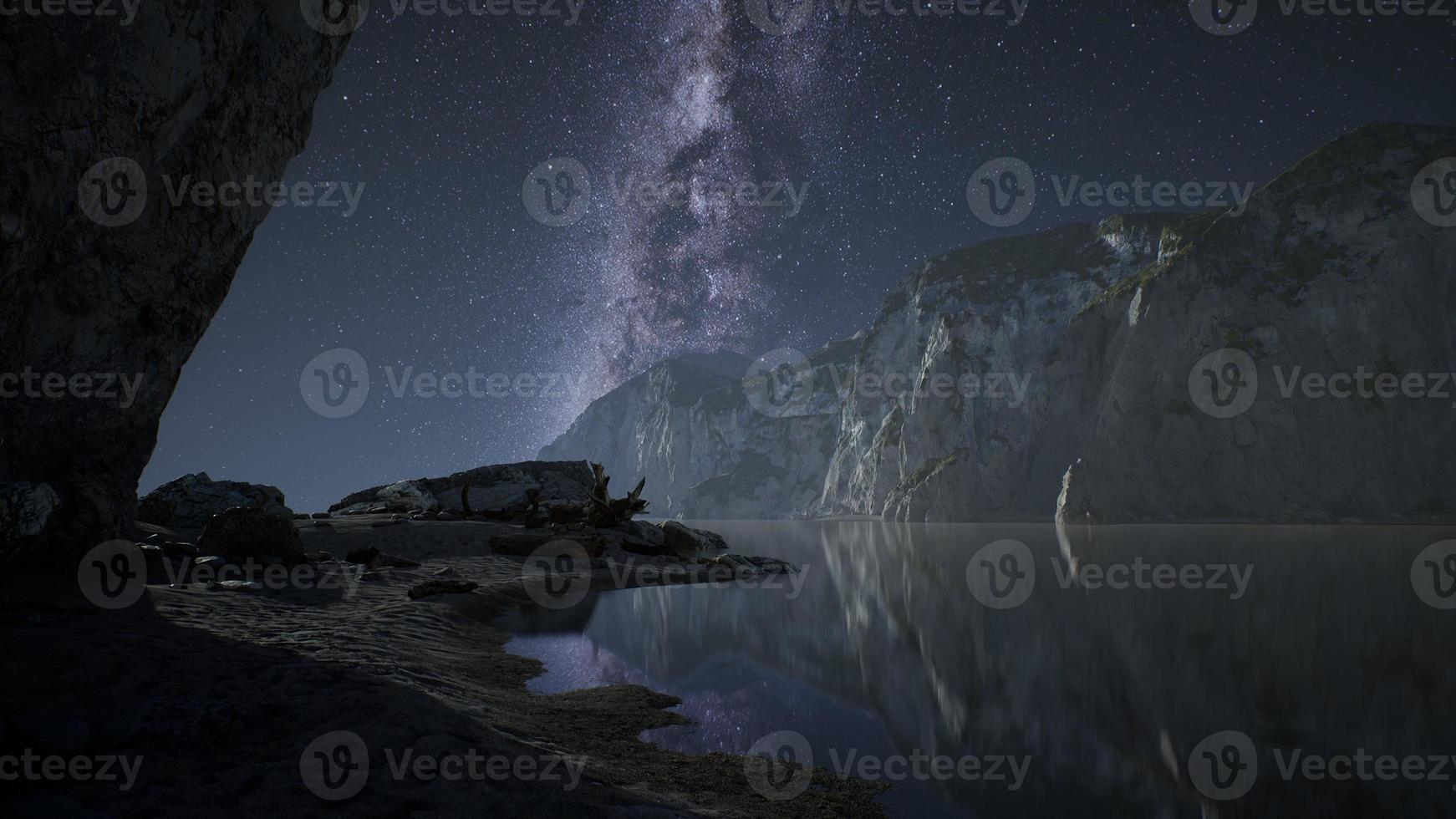 hyperlapse of night starry sky with mountain and ocean beach in Lofoten Norway photo