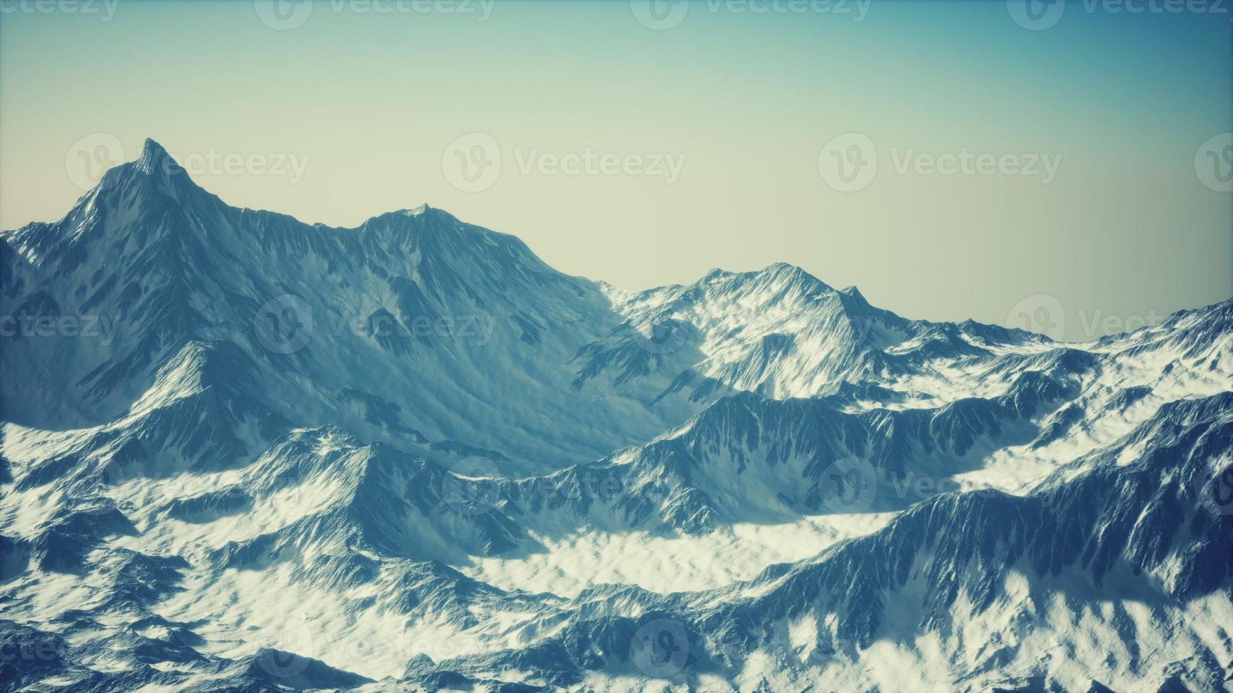 Aerial view of the Alps mountains in snow photo