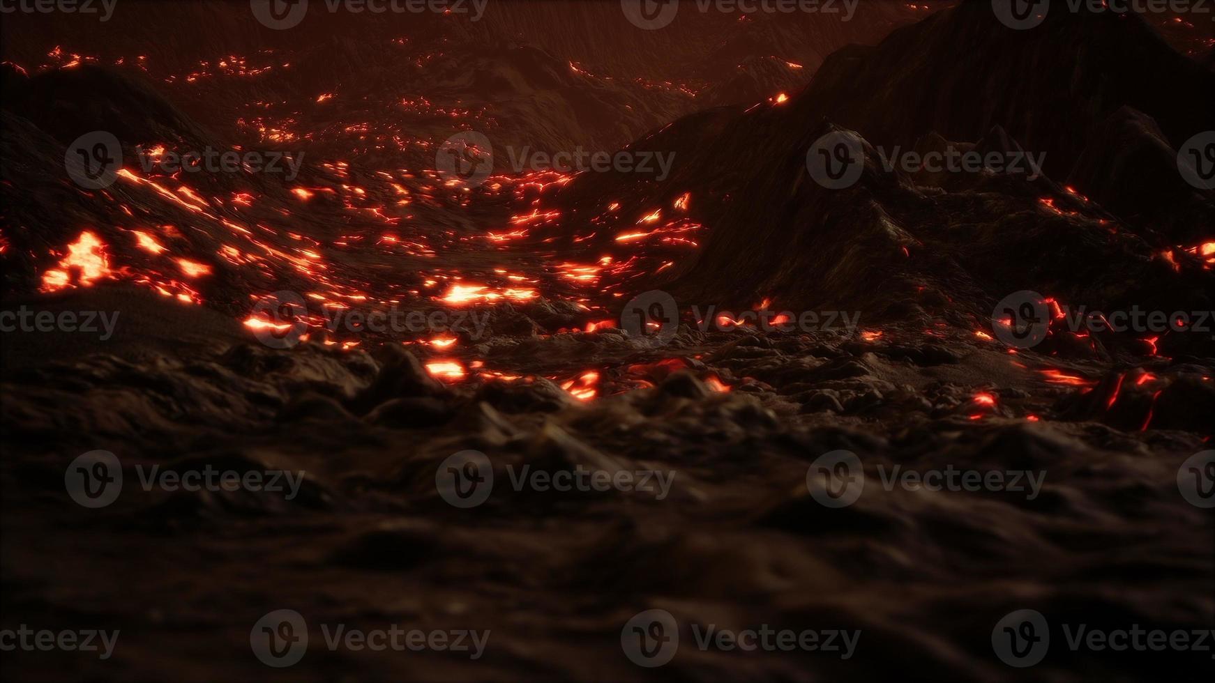 Red Orange vibrant Molten Lava flowing onto grey lavafield and glossy rocky land photo