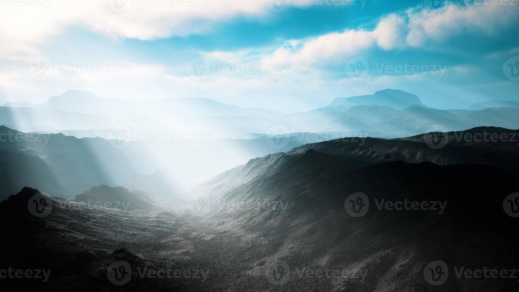 aerial vulcanic desert landscape with rays of light photo