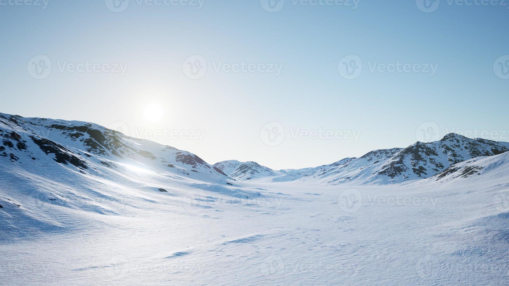 Aerial Landscape of snowy mountains and icy shores in Antarctica photo