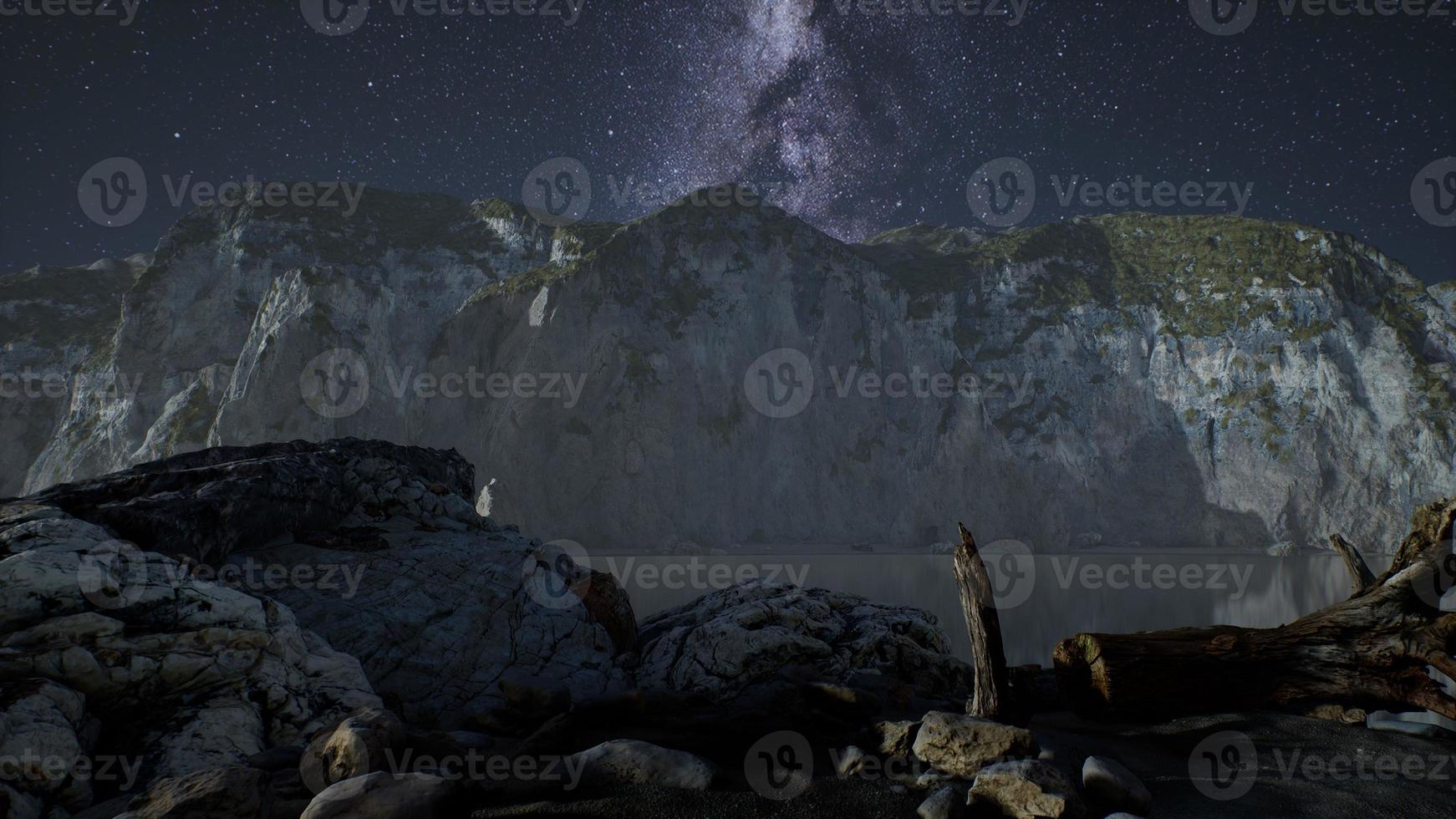 hyperlapse of night starry sky with mountain and ocean beach in Lofoten Norway photo