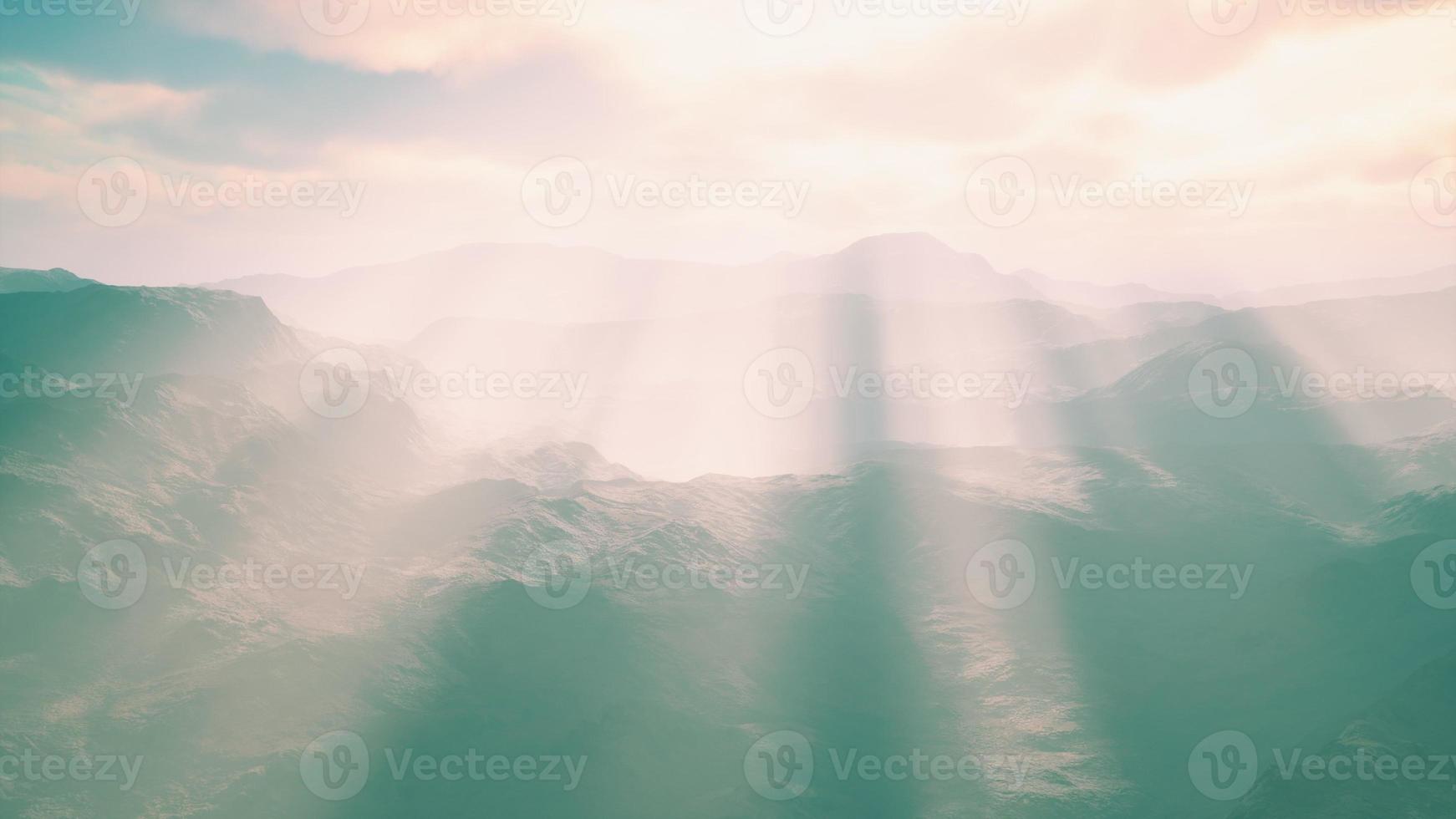 aerial vulcanic desert landscape with rays of light photo