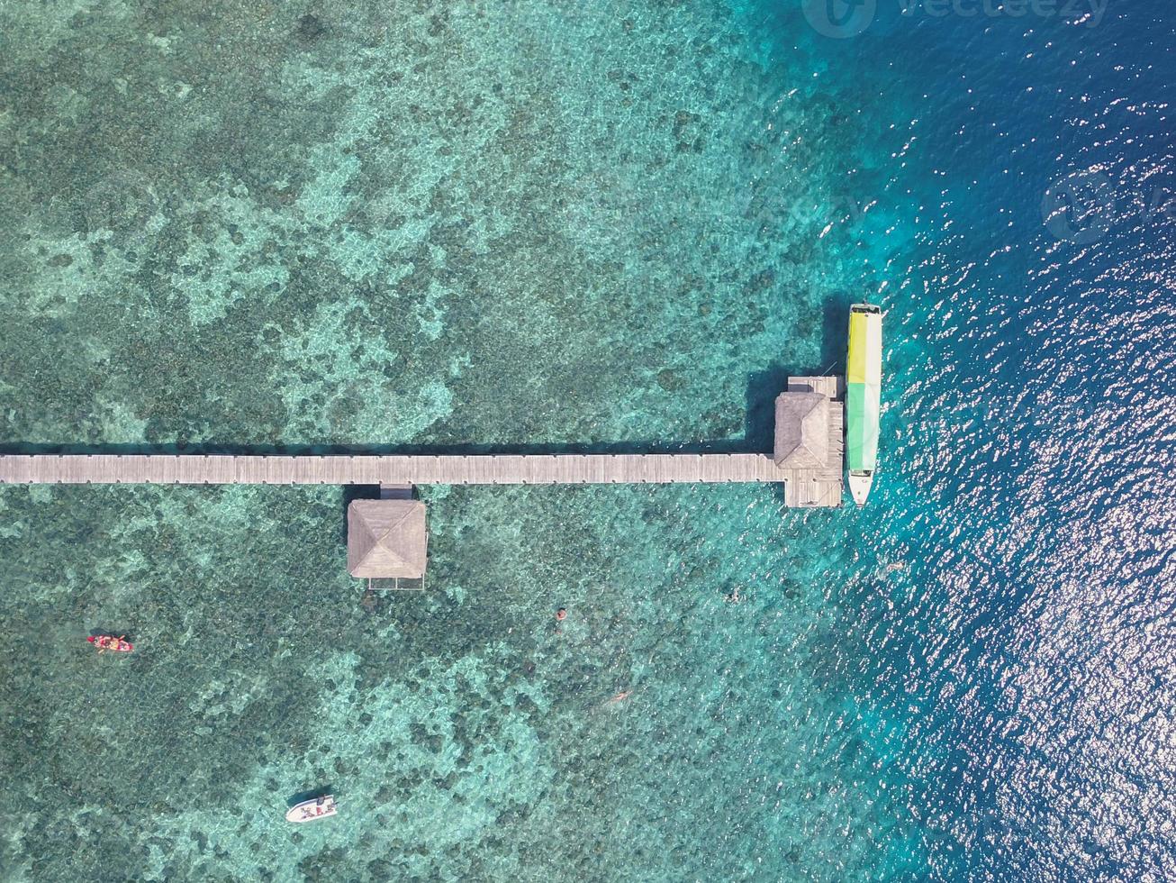 Blue turquoise water sea island with green tree summer vacation background by drone photo