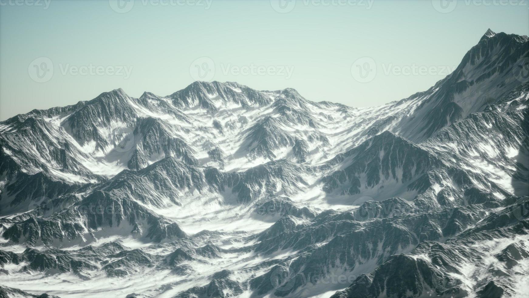 Aerial view of the Alps mountains in snow photo