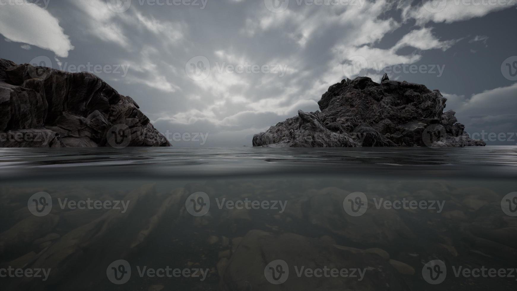 Half underwater in northern sea with rocks photo