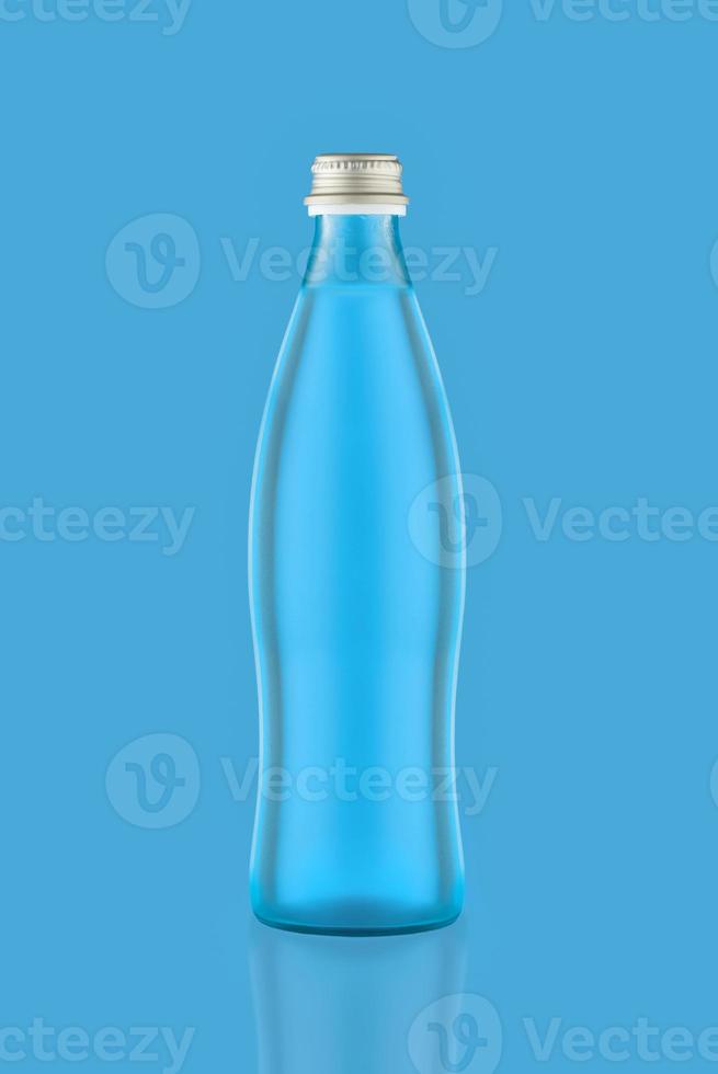 Blue glass bottle with metal lid isolated on blue background. photo